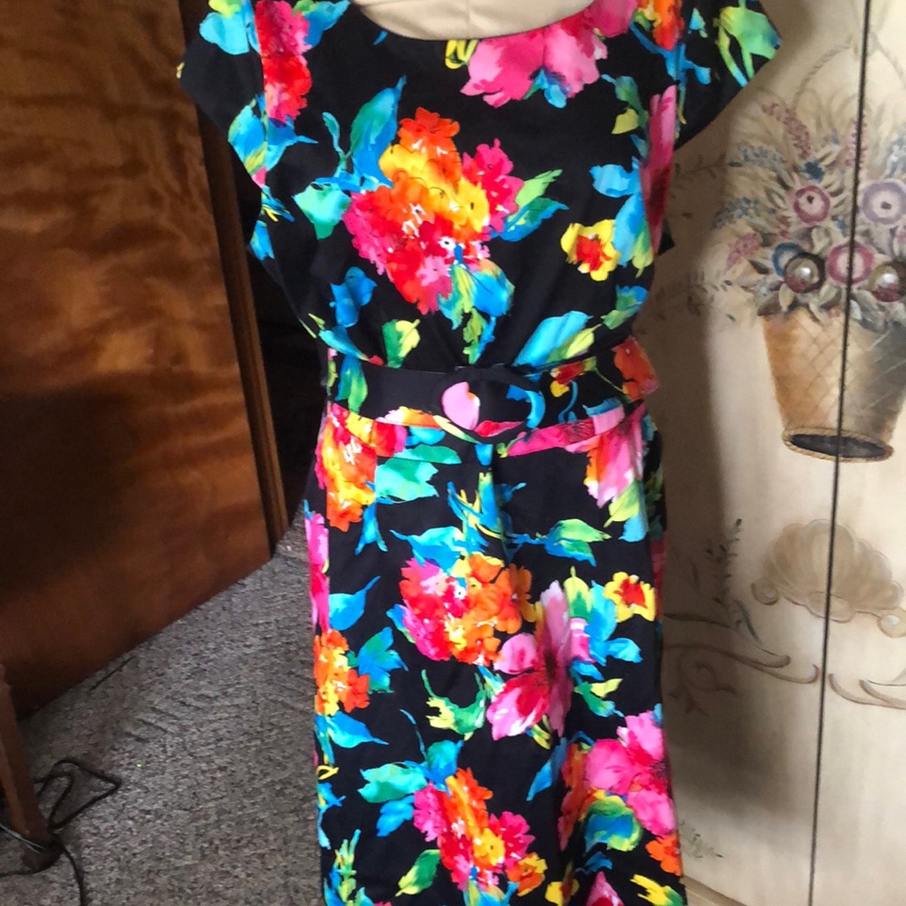 Floral dress with rounded neckline and belt.
